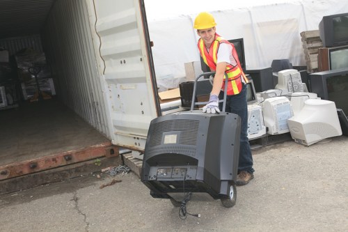 Professional loading of a skip with household waste