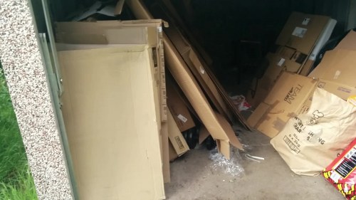 Secure lockable skip with waste materials